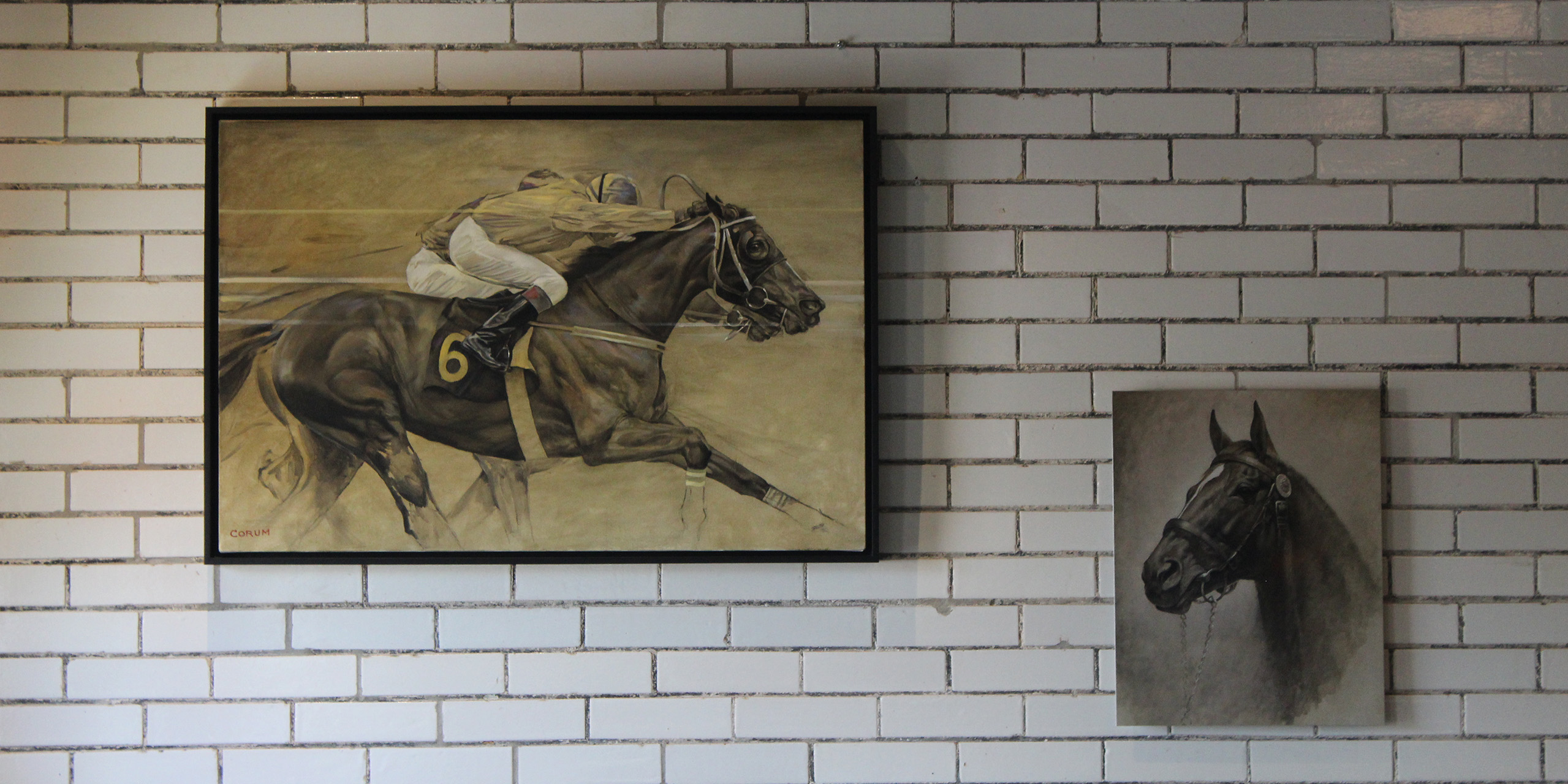 Horse racing paintings on a ceramic tile wall